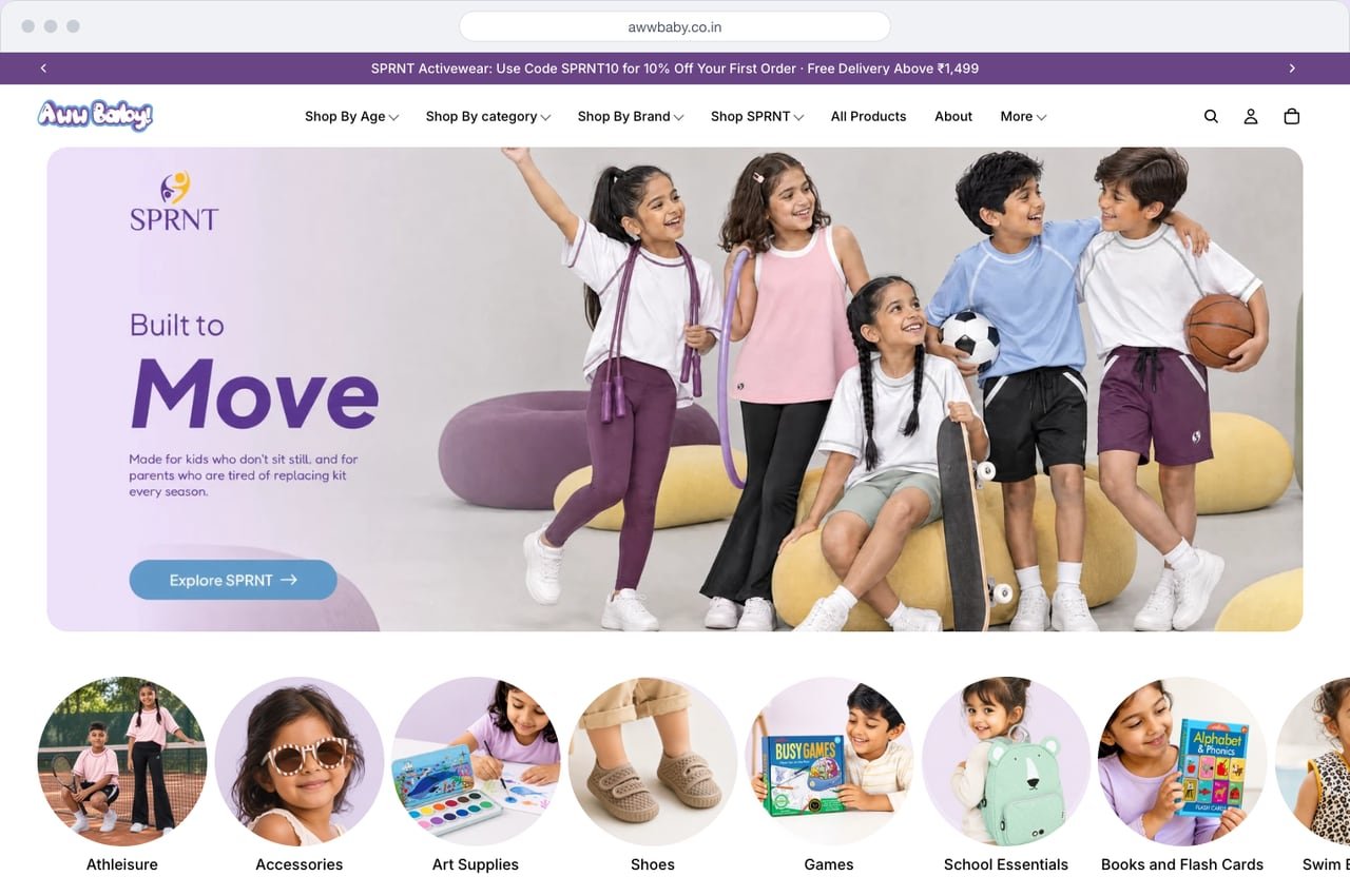 AwwBaby homepage on desktop with Shop by age, category and brand in the menu, an activewear banner and round category tiles